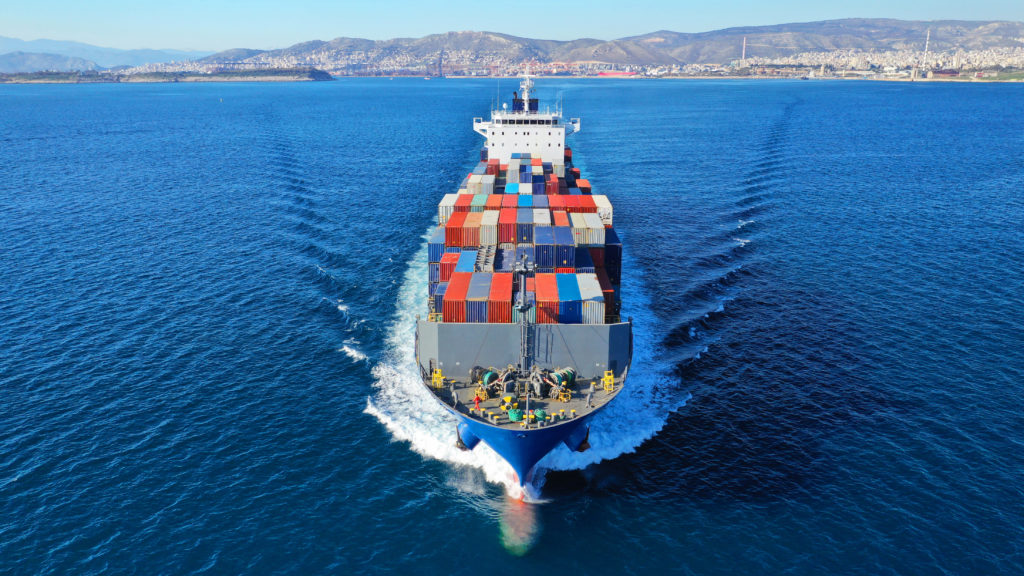 Trade Remedy Analysis. Freight boat on ocean with containers.